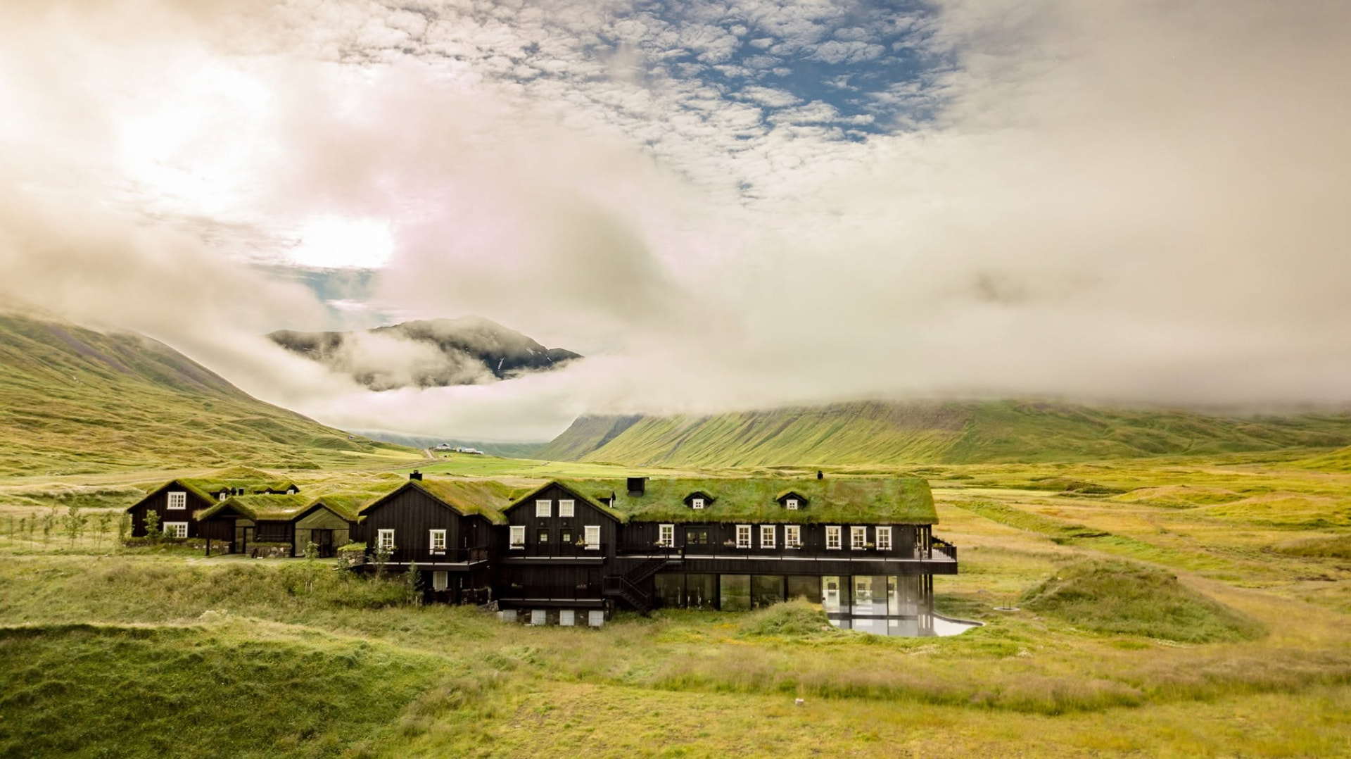 Eleven Deplar Farm lodge with turf roofs in the green Fljót valley on Tröllaskagi