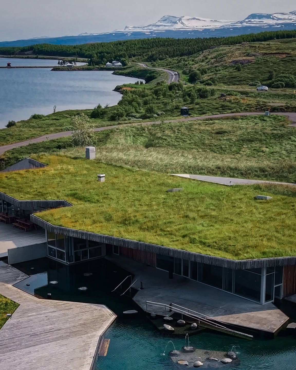 Vök Baths geothermal pools and turf-roofed building beside Lake Urriðavatn in Egilsstaðir
